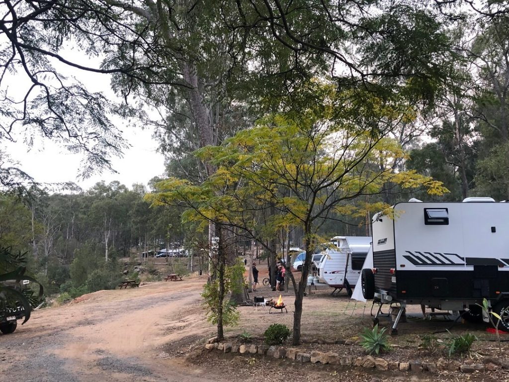 Caravan parked in a wooded area at Murphy's Creek