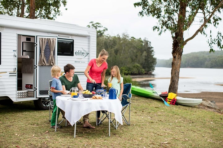family outside a caravan