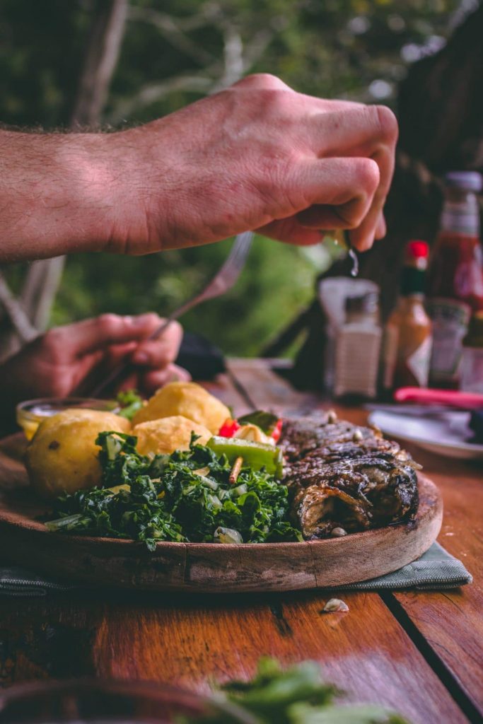 Sizzling steak served on a wooden tray, ready to be enjoyed