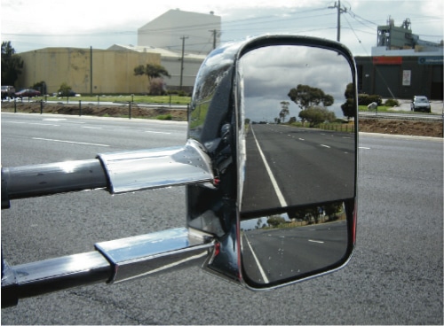 The open road awaits, thanks to a secure caravan hitch reflected in the mirror