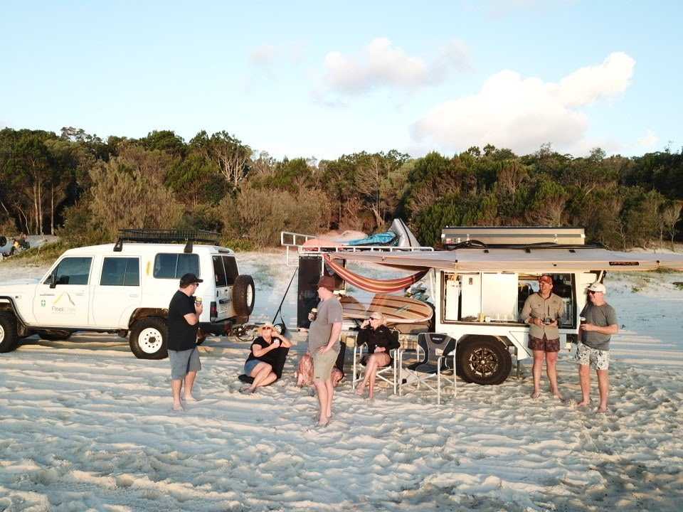 AllBrand Camping Adventures caravan parked beside a scenic beach, offering the perfect campsite getaway