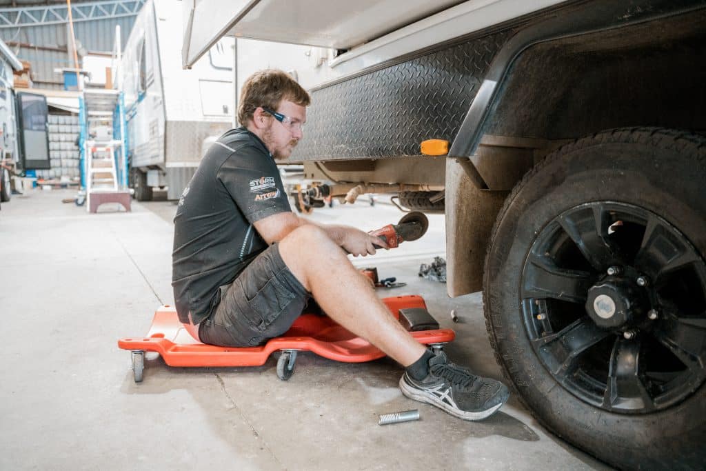 Mechanic using high-tech equipment to diagnose engine issues