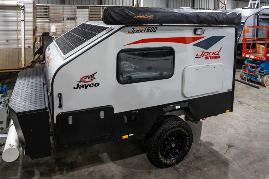 Jayco Pod camper parked at a shop