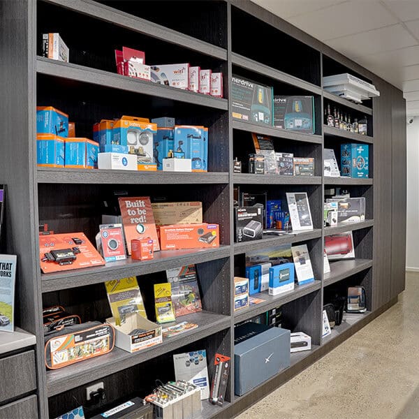 A selection of caravan accessories showcased in an open cabinet near the concierge desk