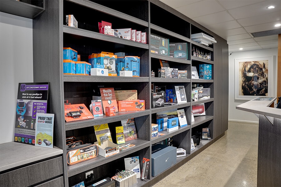 A selection of caravan accessories showcased in an open cabinet near the concierge desk