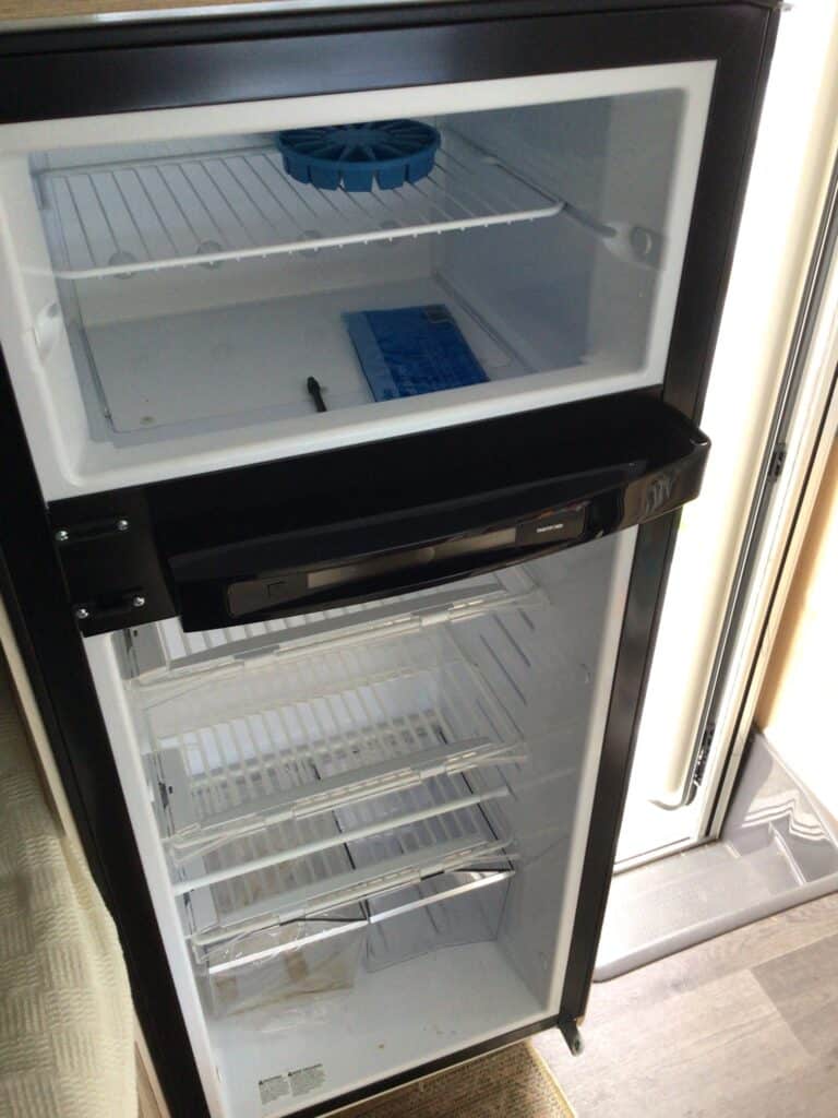 Spacious Bushman fridge for your caravan, featuring efficient cooling and convenient storage