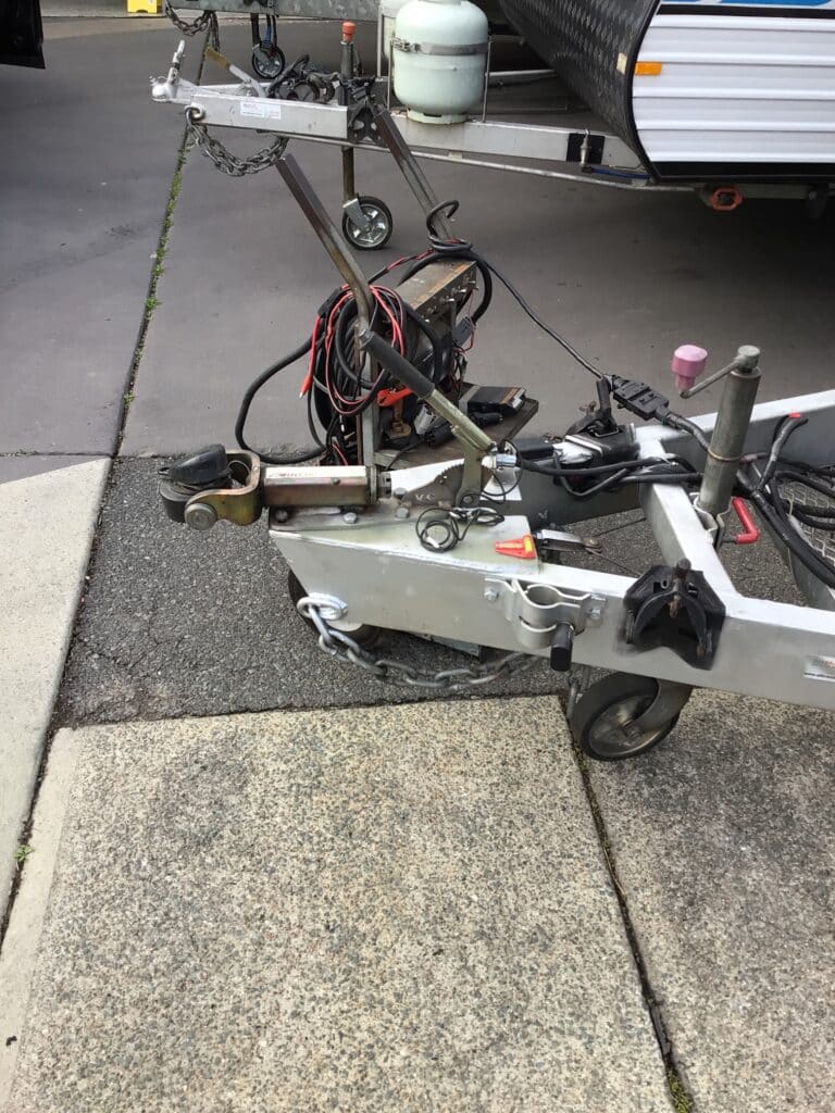 Weight distribution hitch displayed outside shop, ready for installation and improved towing stability