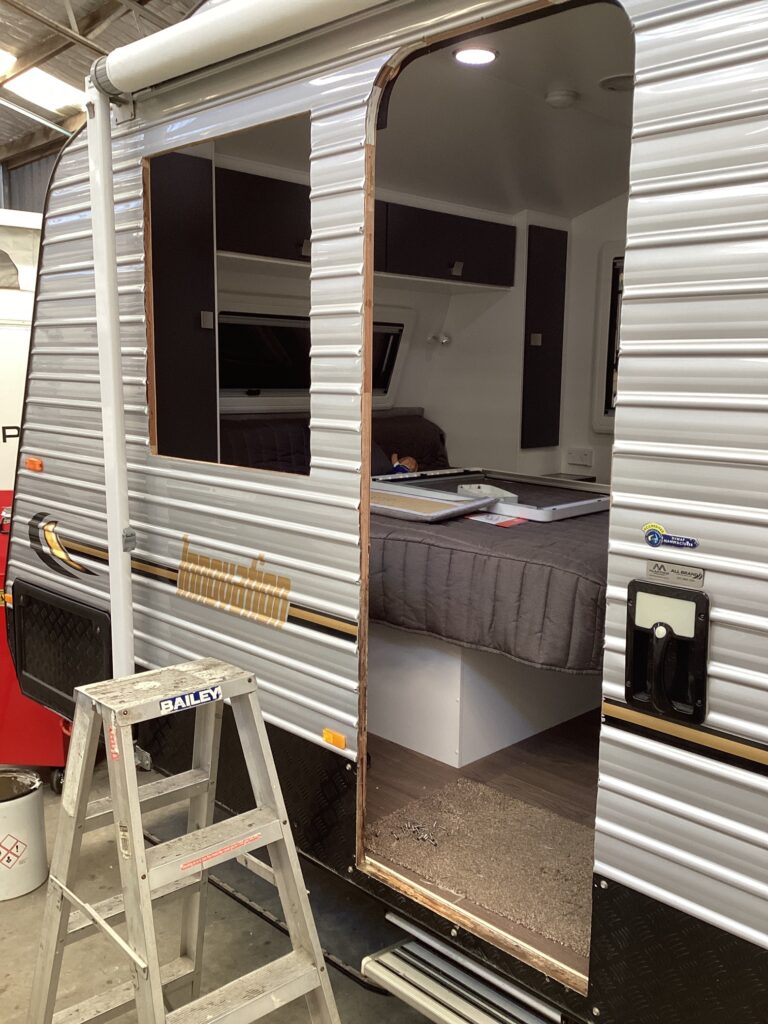 Close-up view of different caravan window features, such as double glazing, insect screens, and blinds