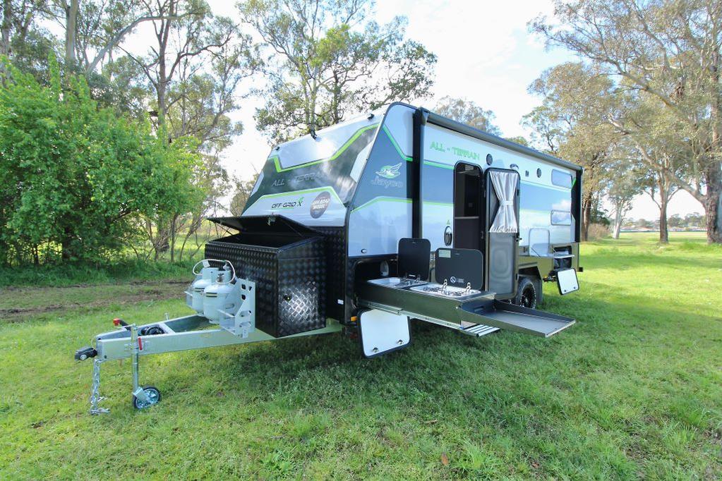 A Jayco Off Grid camper parked amongst trees, ready for off-the-grid exploration