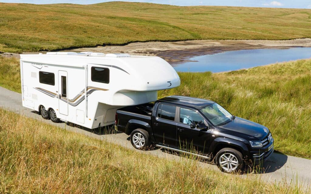 Fifth-wheel and 4x4 prepping for an off-road adventure.