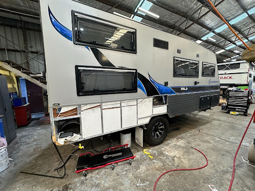 Caravan with damaged checker plate rear bumper removed