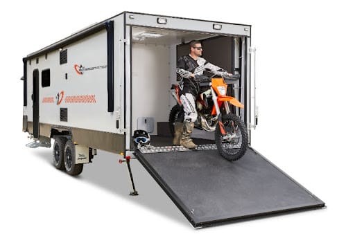 Can't decide between an RV and bringing your toys? A toy hauler solves that problem